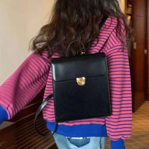 Retro Casual Black Leather Backpack for Women - Minimalist Travel Commuter Bag with Artistic Design